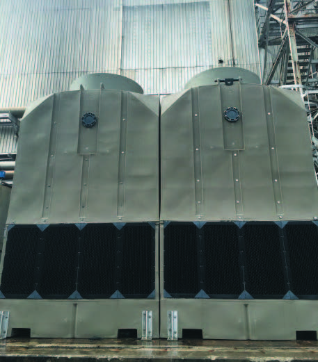 The mill’s new engineered plastic Delta cooling towers are made out of beige high-density polyethylene (HDPE). Picture is a close up of the installed 